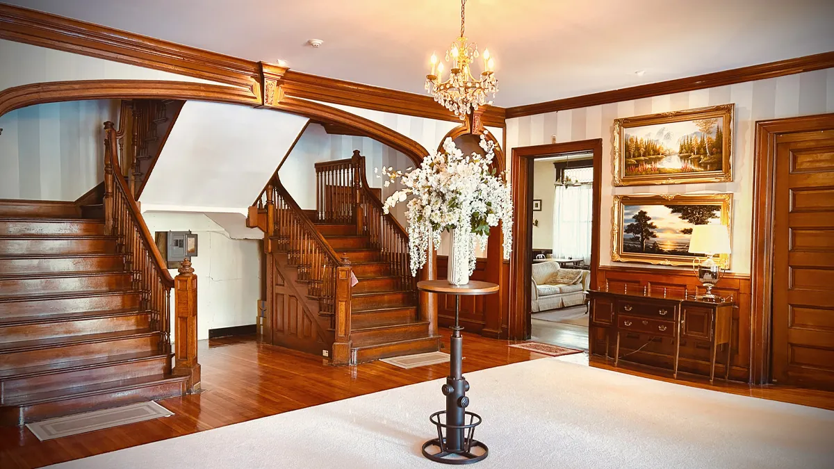 Historic Idylease lobby with original wood staircase and architectural details